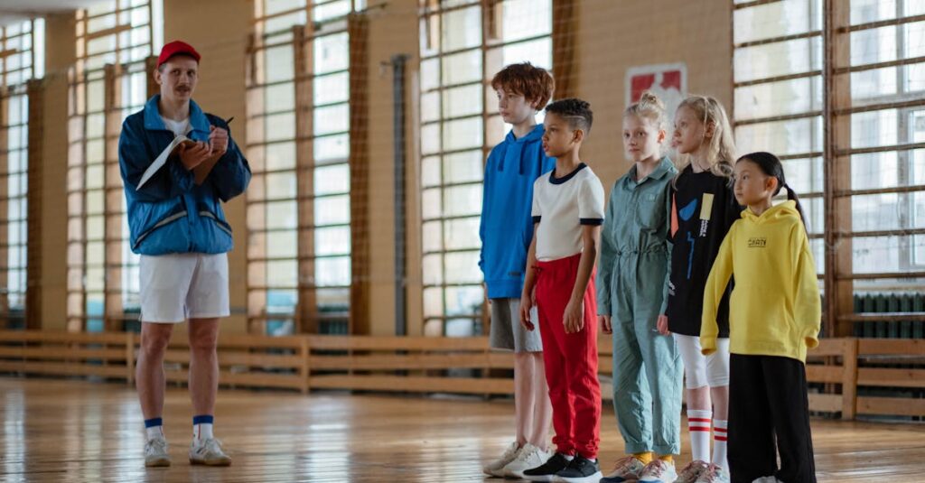 A coach instructing a diverse group of children during a gym class in a school sports hall.